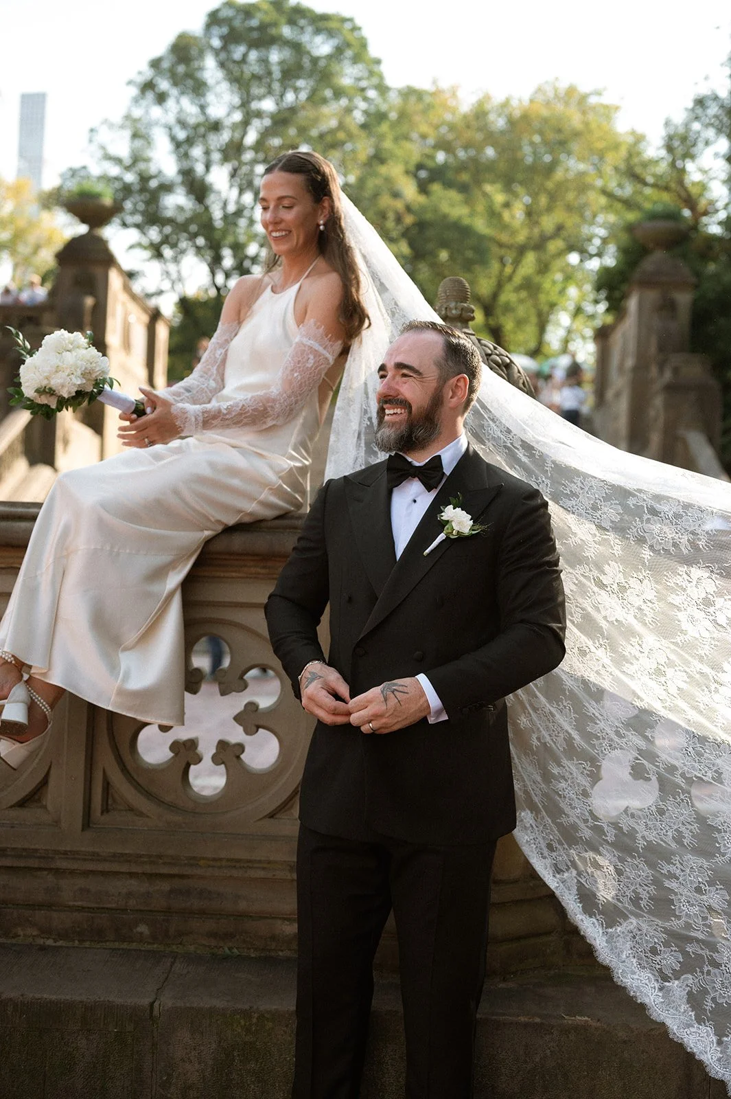 Bride and groom posing at Bethesda Terrace in Central Park after their Cakewalk micro wedding.