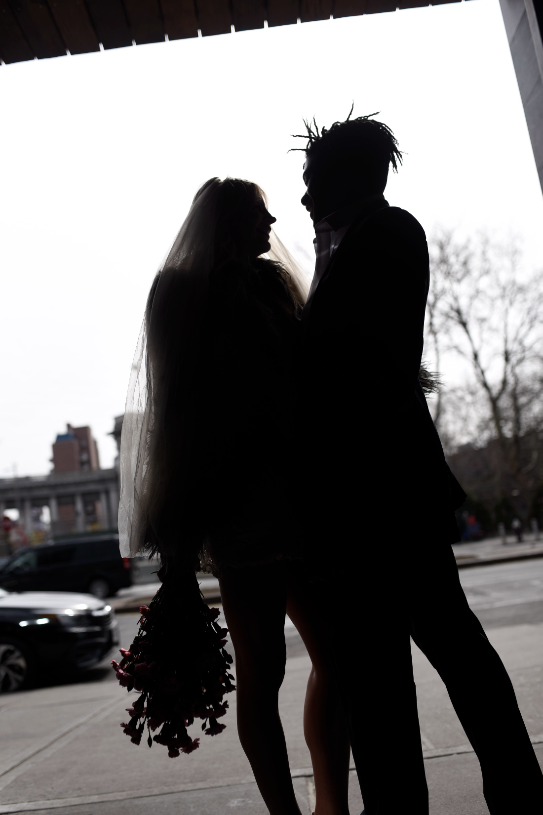 Silhouette of bride and groom embracing before their Cakewalk elopement.