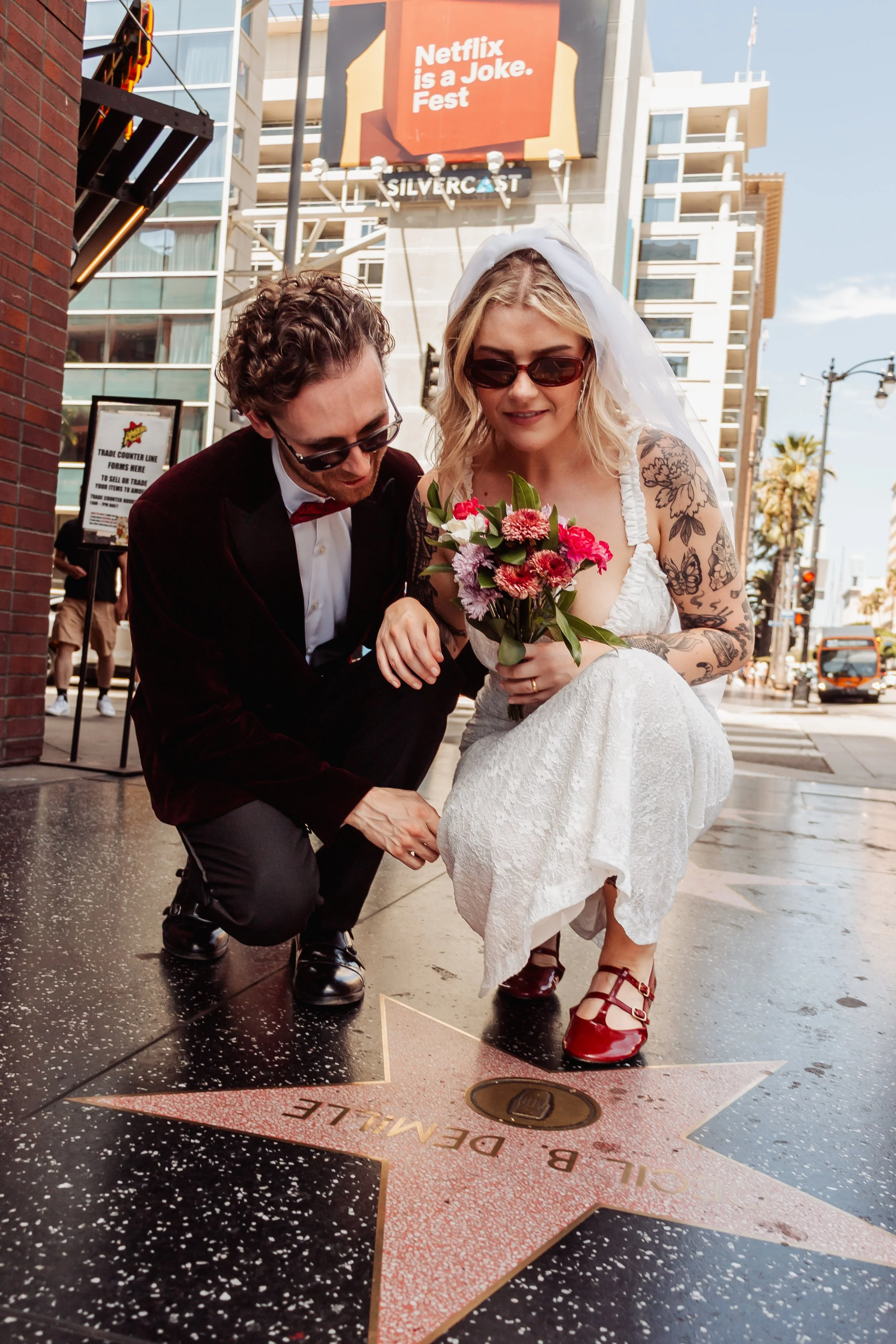 Couple looking at Walk of Fame on Hollywood Blvd during their Cakewalk elopement.