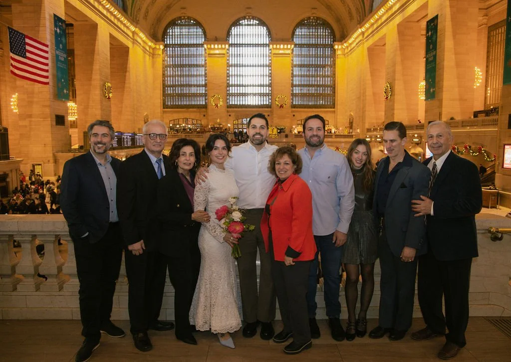 Family group shot with newly married couple  at Grand Central Station after their NYC Cakewalk elopement ceremony.