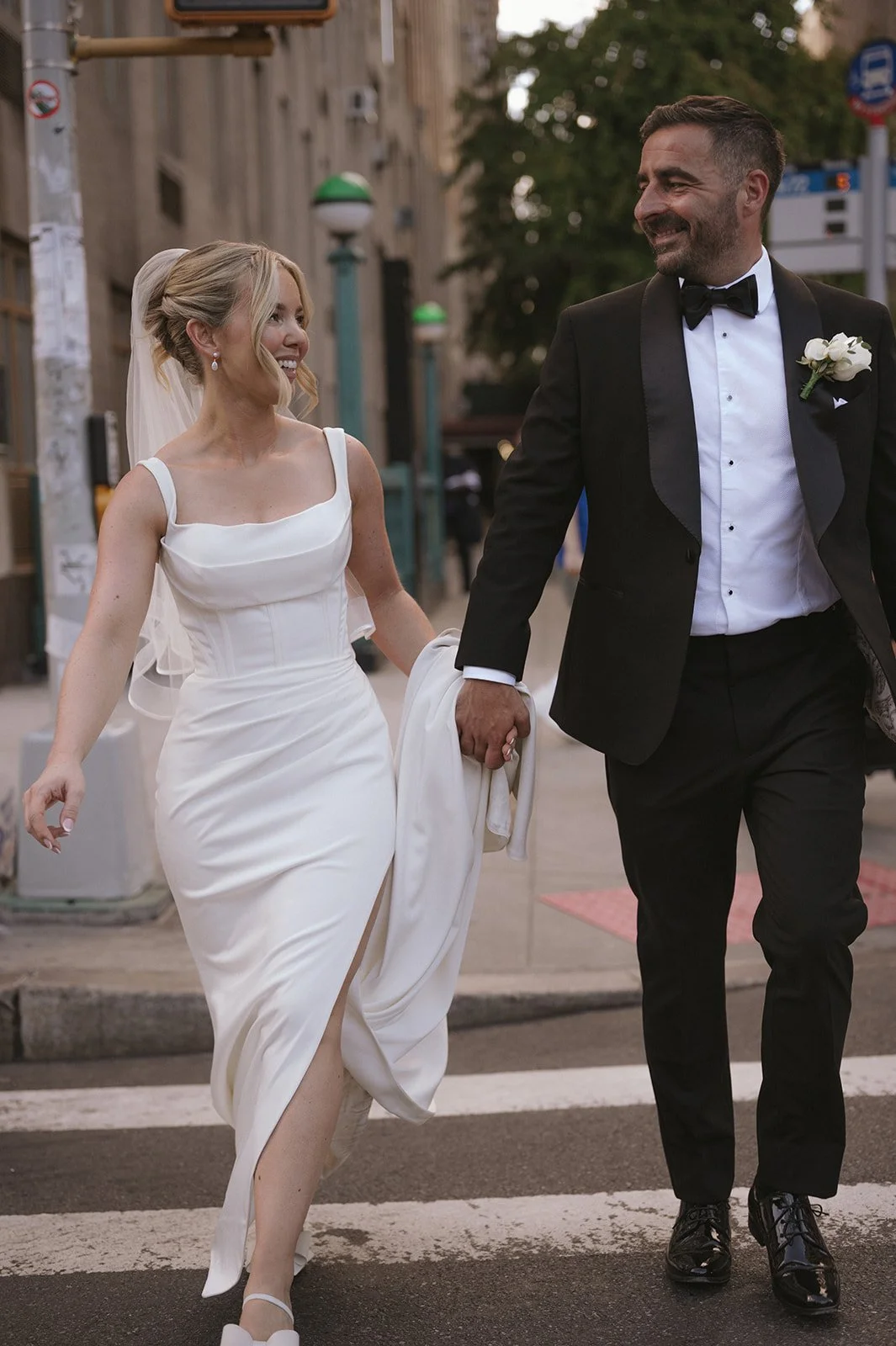 Bride and groom crossing the street in Manhattan.