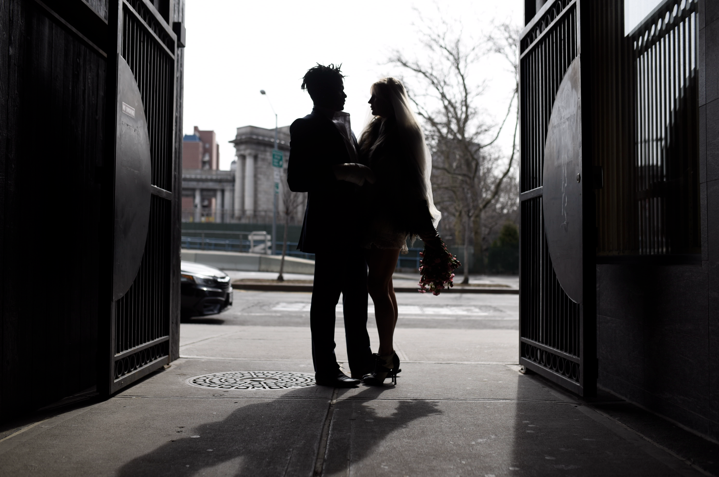 Silhouette of bride and groom embracing before their Cakewalk elopement.