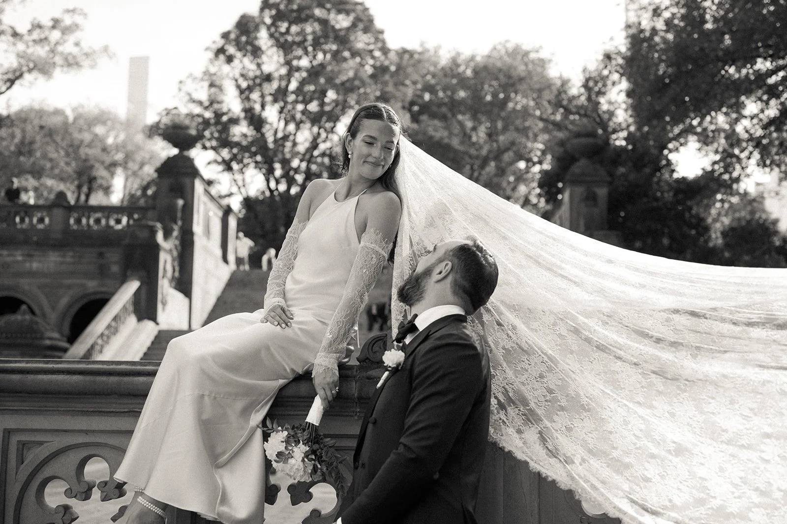 Bride and groom posing at Bethesda Terrace in Central Park after their Cakewalk micro wedding.