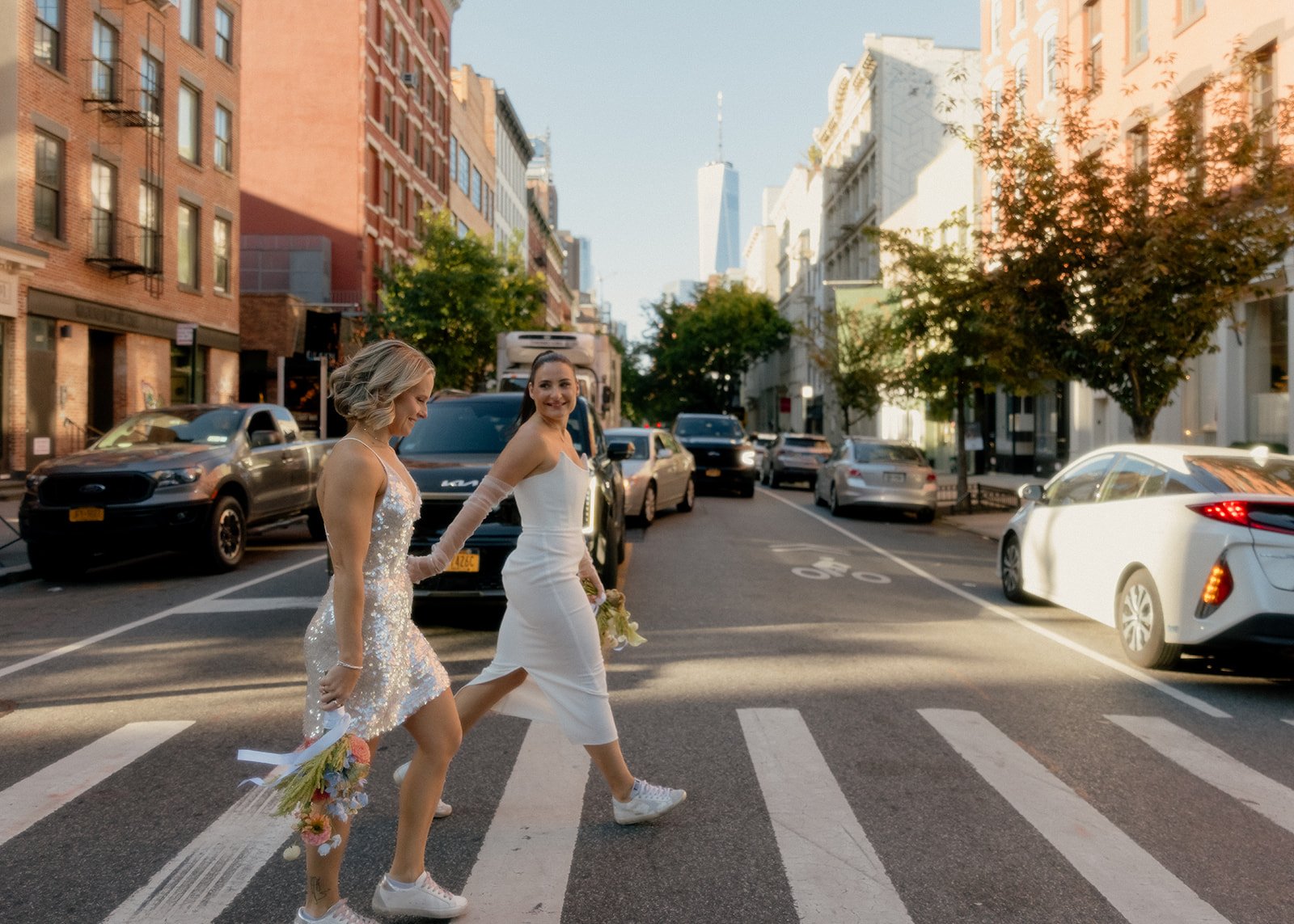Lesbian brides crossing the street in Manhattan after their Cakewalk elopement.