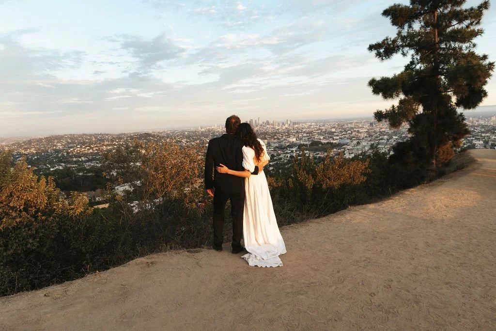 Couple overlooking the LA Basin from Griffith Observatory at their Cakewalk elopement ceremony.