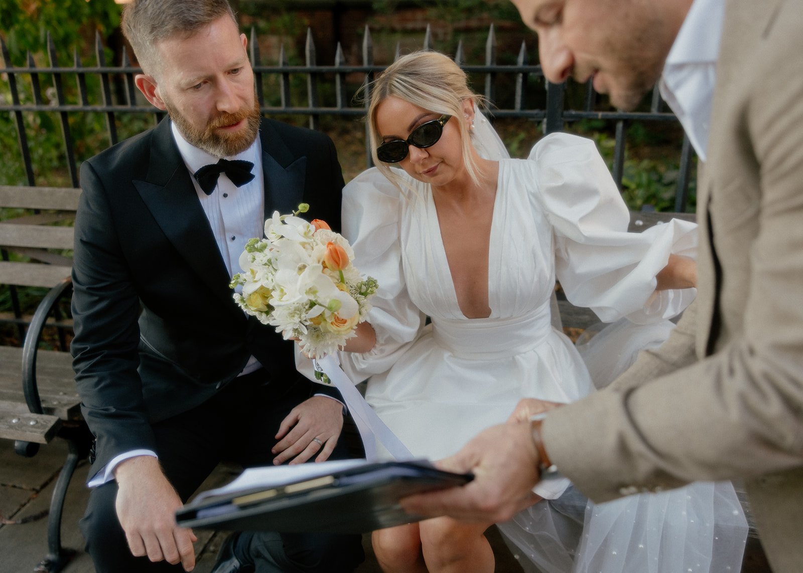 Bride and groom assisted by Cakewalk officiant to fill out their marriage license in NYC.