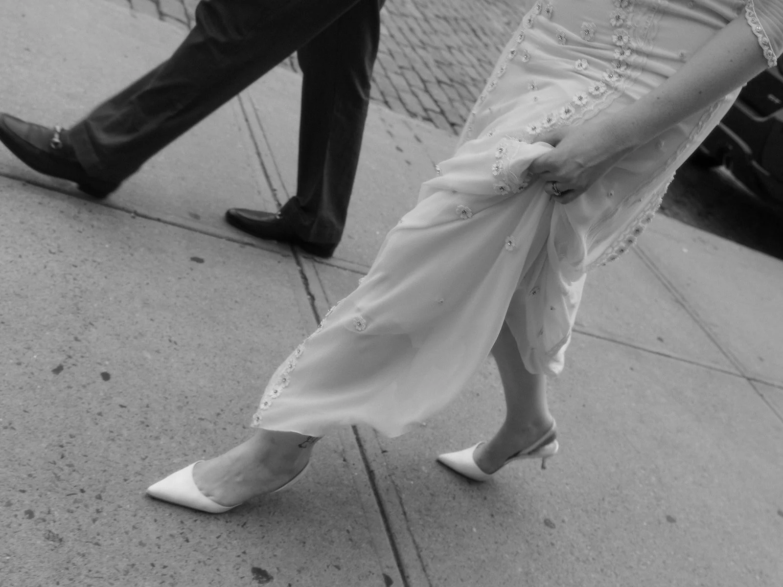 Bride and groom walking down the path on the High Line after their Cakewalk wedding ceremony.