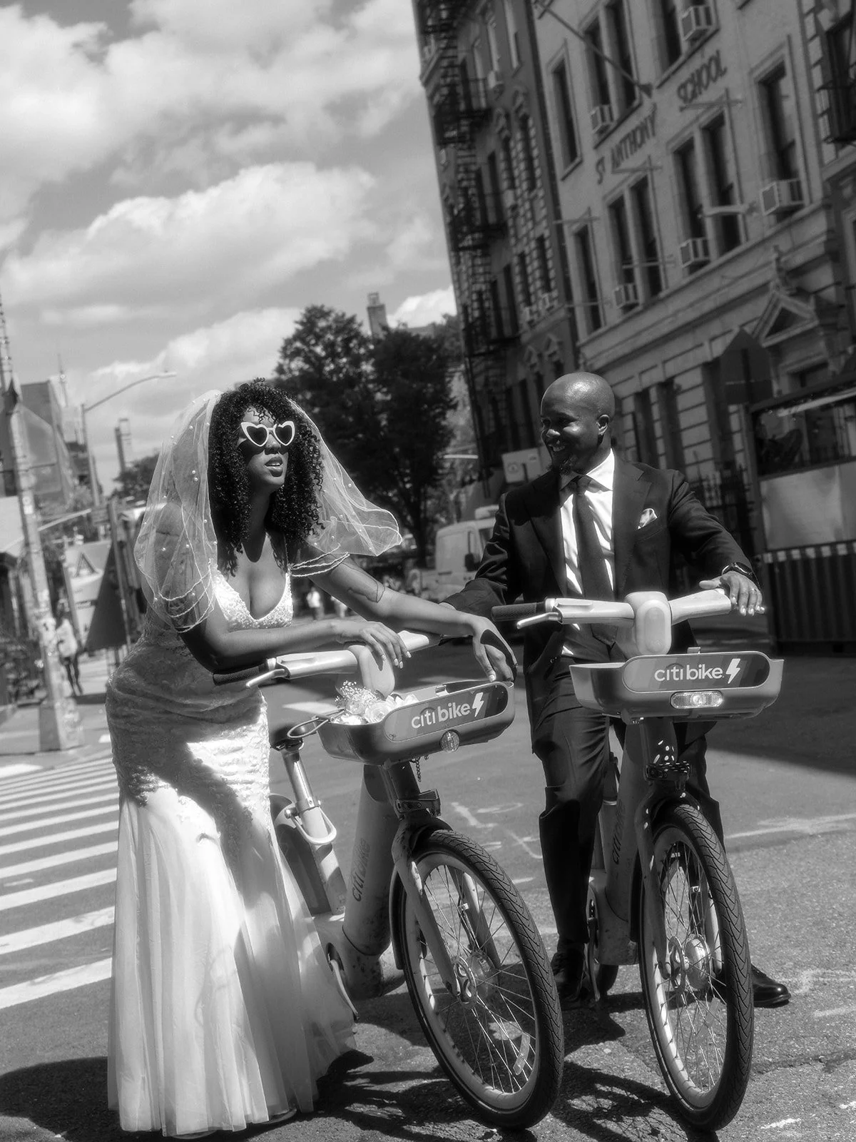 Bride and groom riding Citibikes in NYC after their Cakewalk wedding.
