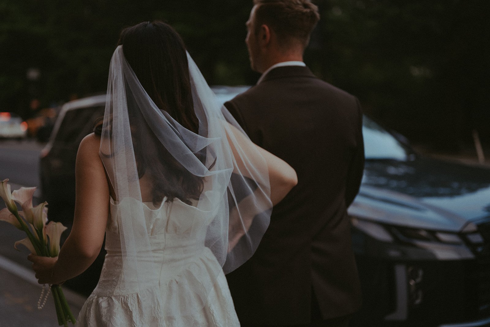 Bride and groom walking in New York City after their Cakewalk ceremony.
