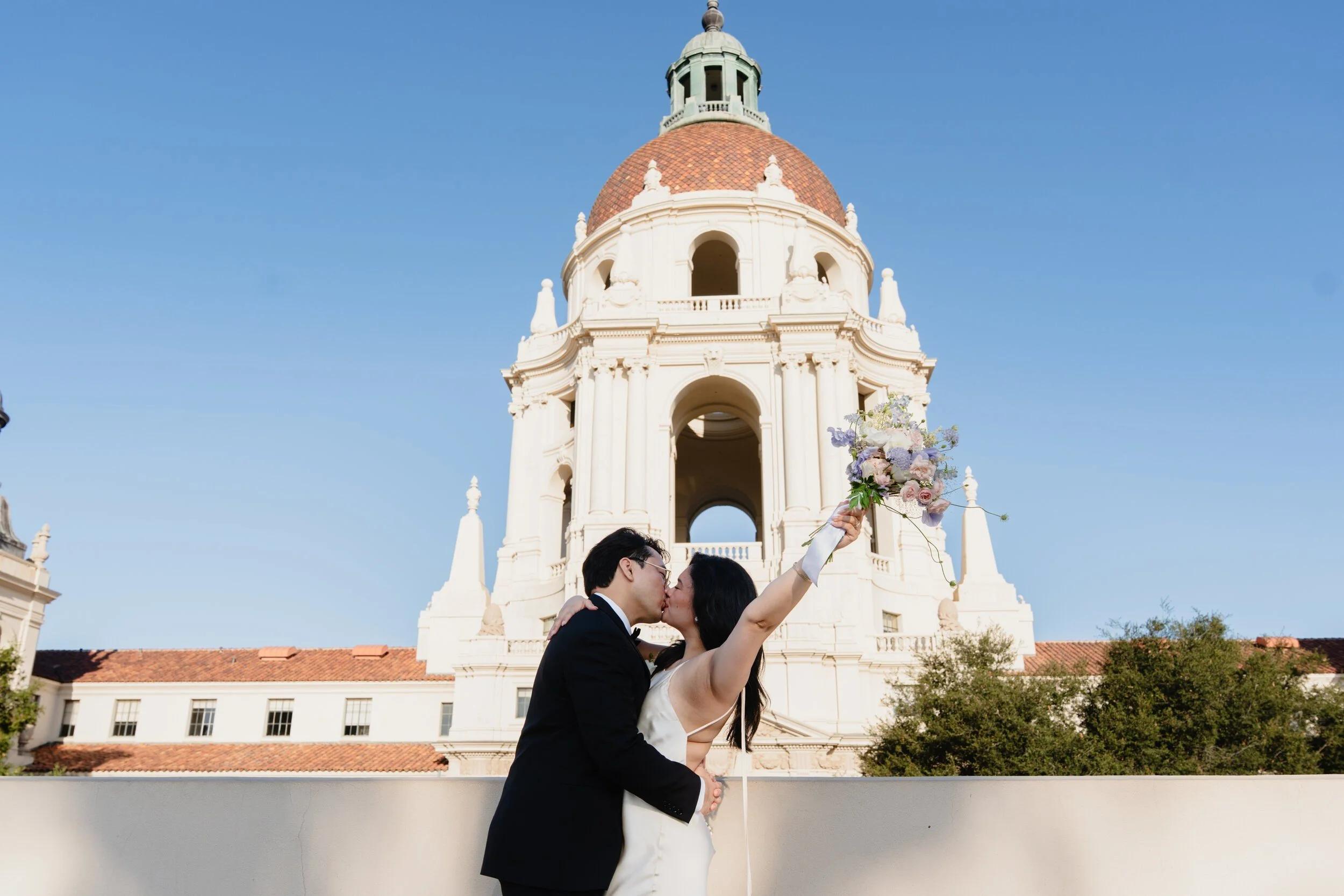 Couple kissing below the dome at their Pasadena City Hall elopement.