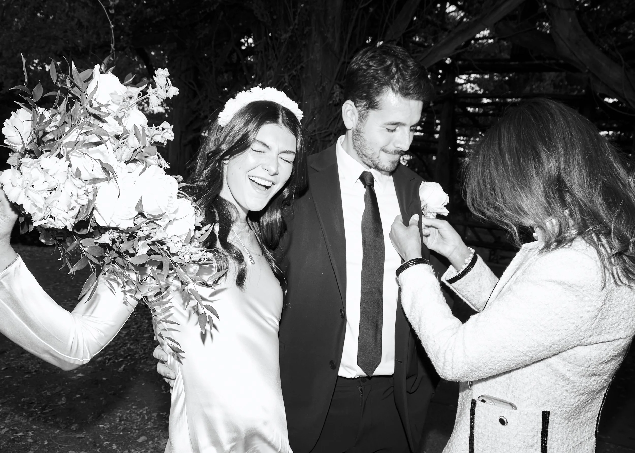 Wedding party pinning a boutonniere before a small NYC ceremony planned by Cakewalk