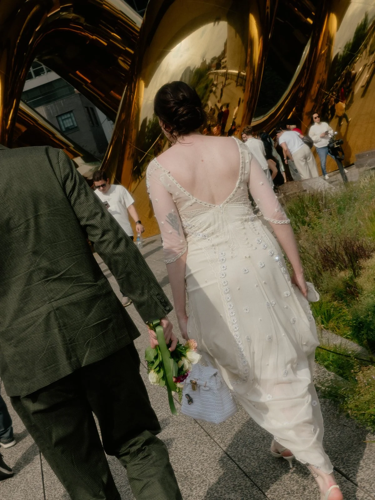 Bride and groom walking onto the High Line for their Cakewalk elopement ceremony.