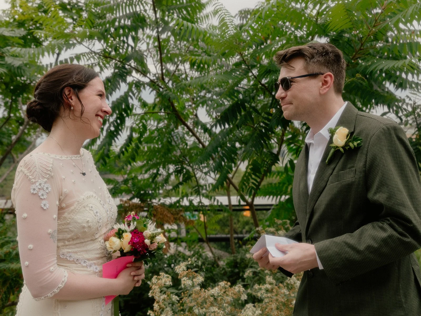 Bride and groom exchanging vows at the High Line in Manhattan during their Cakewalk elopement ceremony.