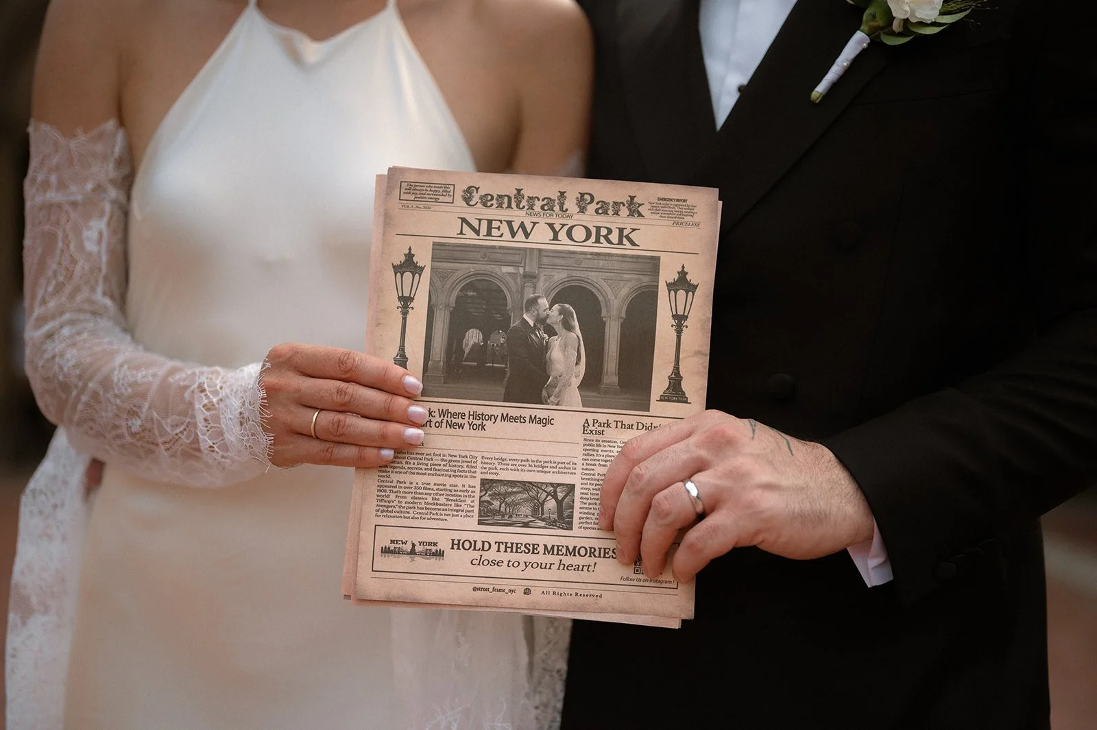 Souvenir newspaper with bride and groom photo in Central Park, held by the couple near Bethesda Terrace. 