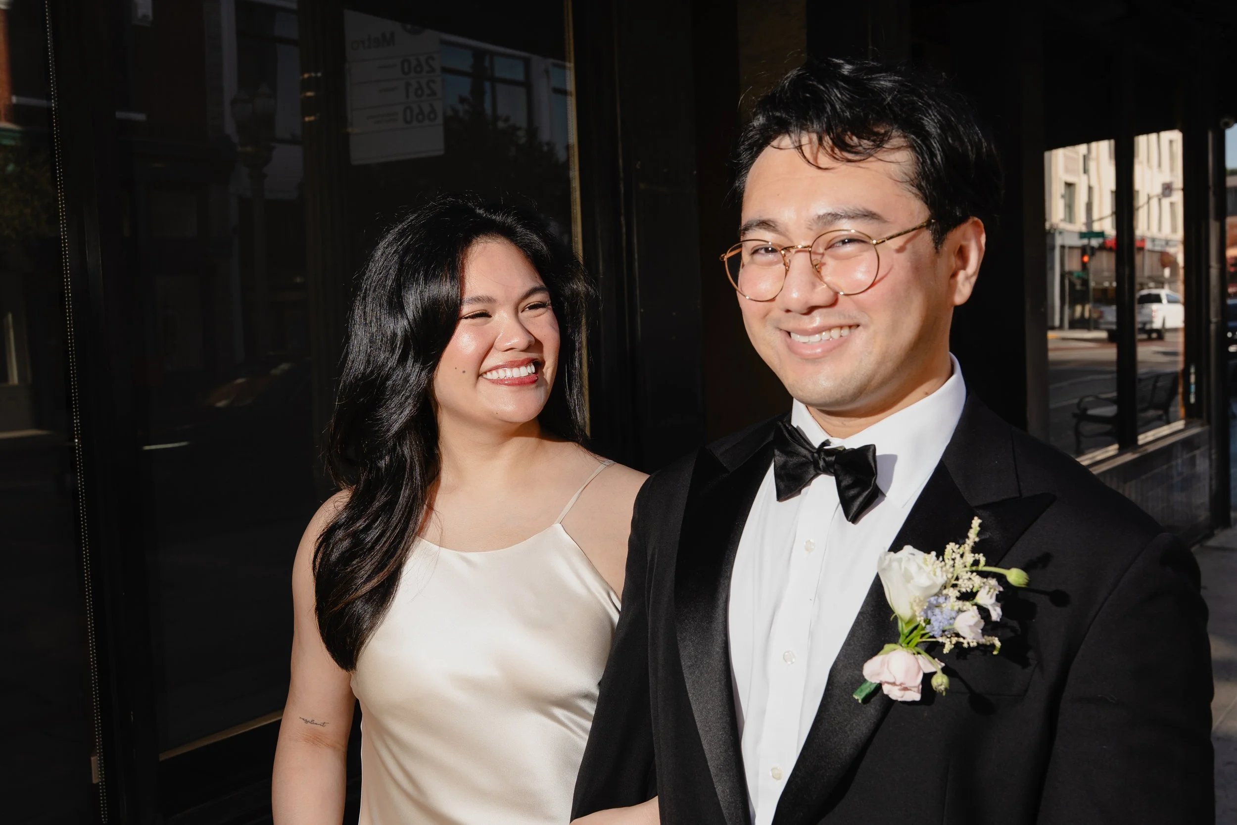 Close up of bride and groom at sunrise on the streets of Old Pasadena after their Cakewalk elopement.