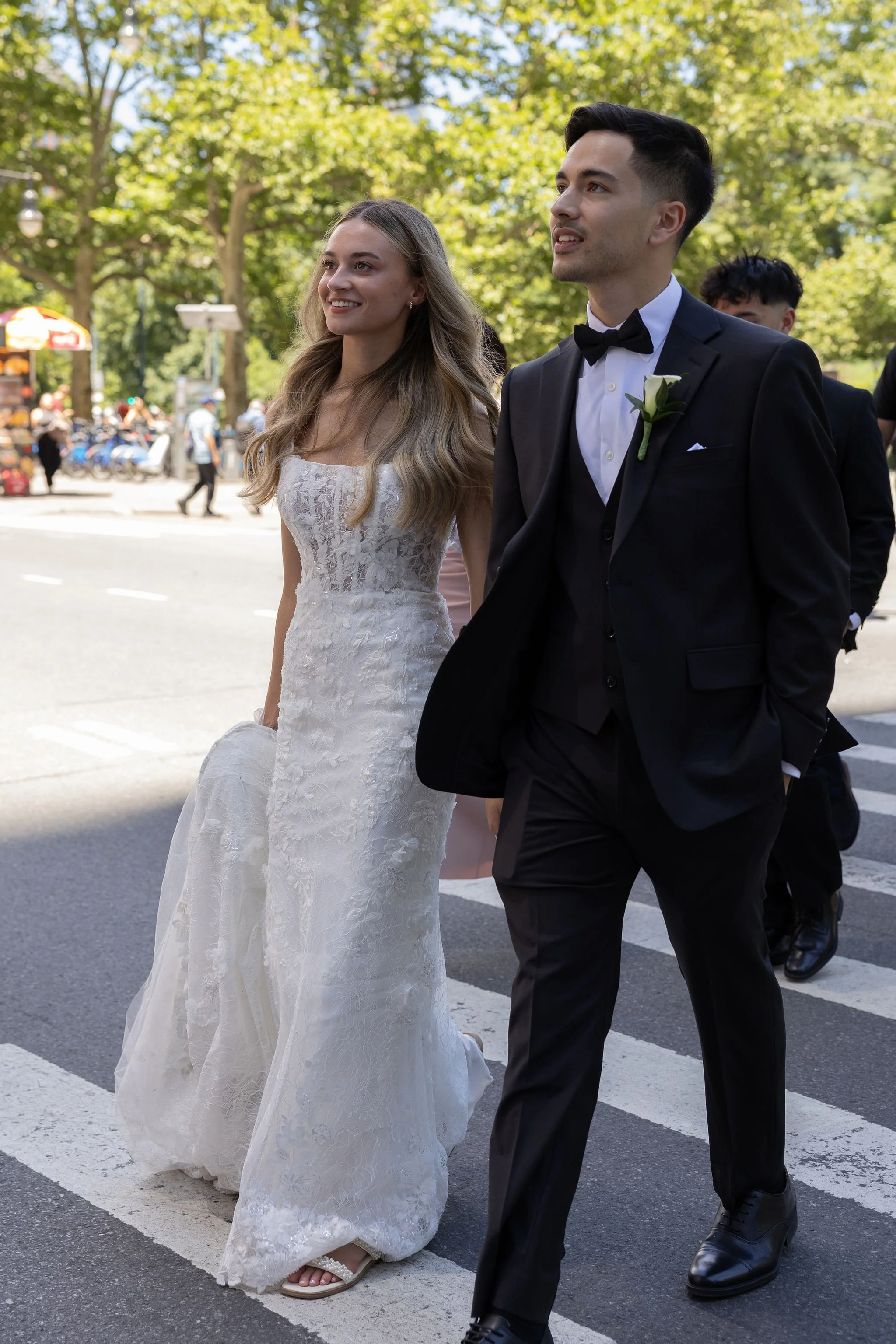 Bride and groom crossing the street towards Central Park before their Cakewalk elopement.