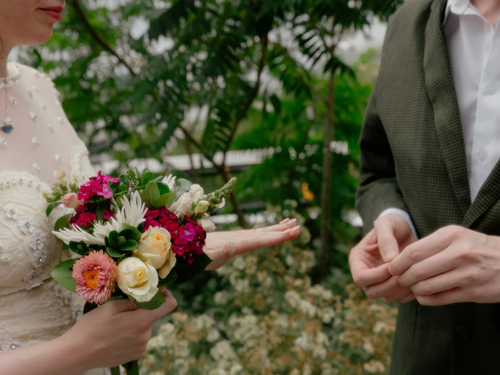 Bride and groom exchanging rings on the during their Cakewalk elopement on New York's High Line.