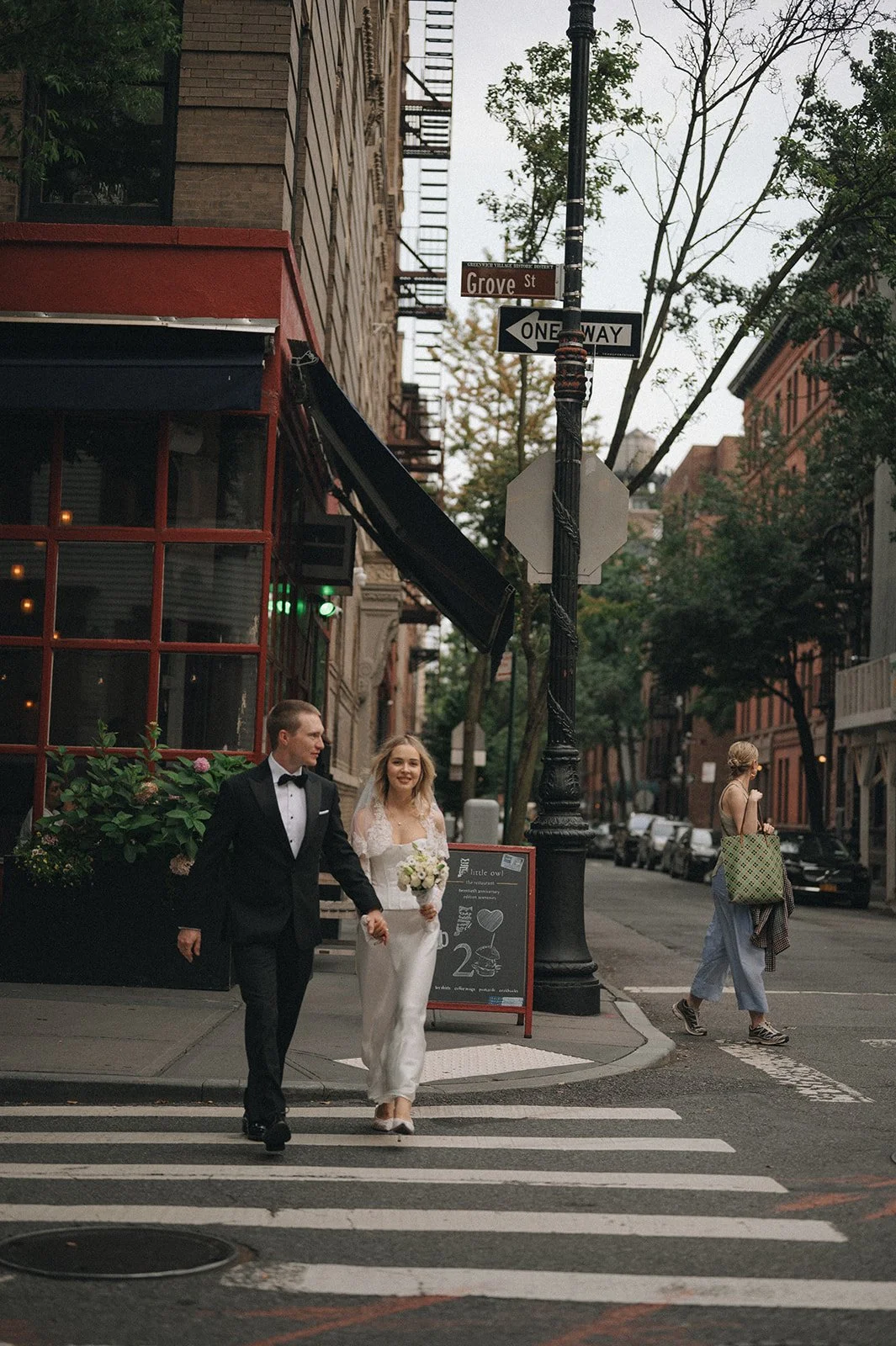 Couple walking through the West Village after their Cakewalk elopement.