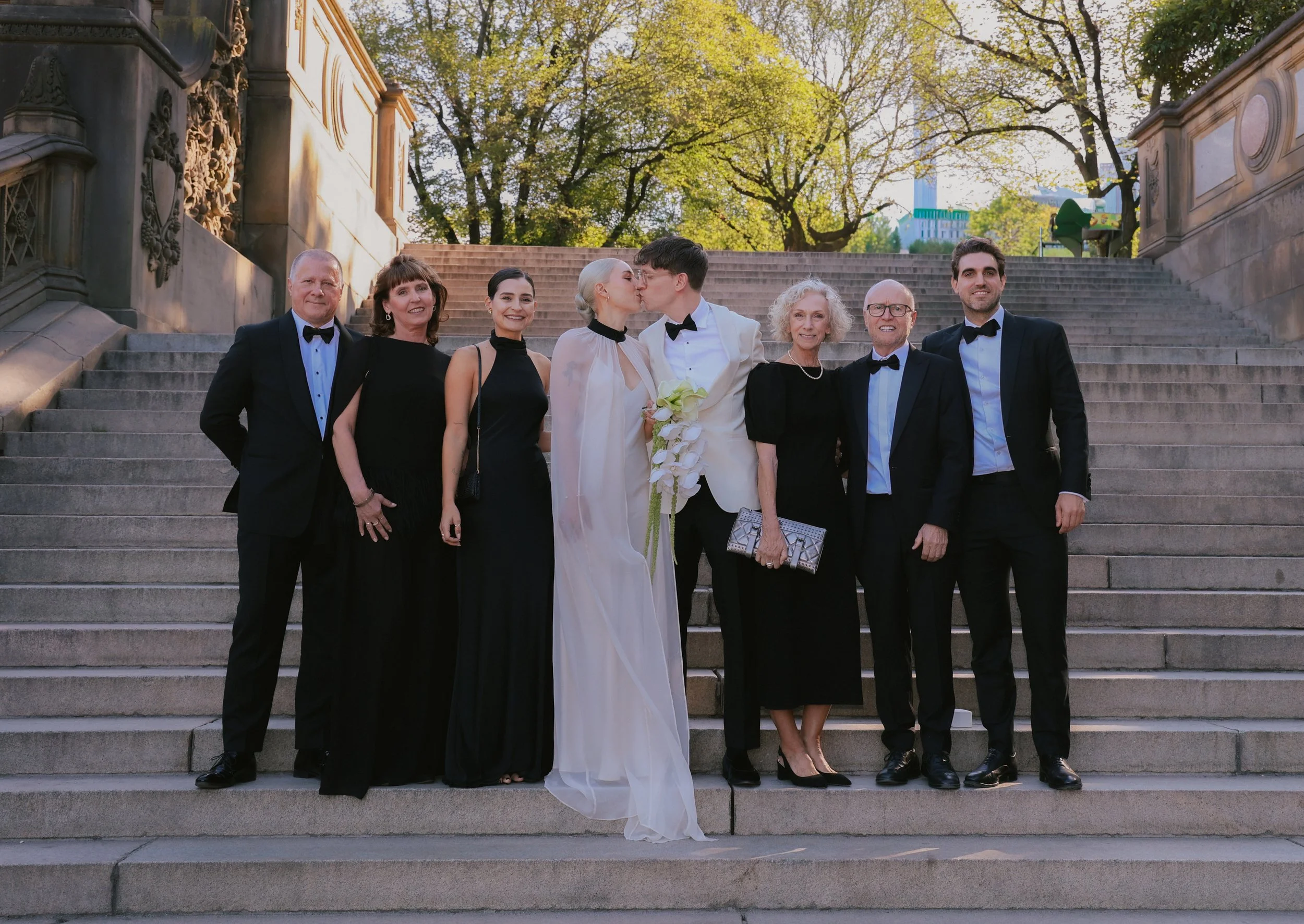 Family portrait on the steps of Bethesda Terrace after elopement style wedding.
