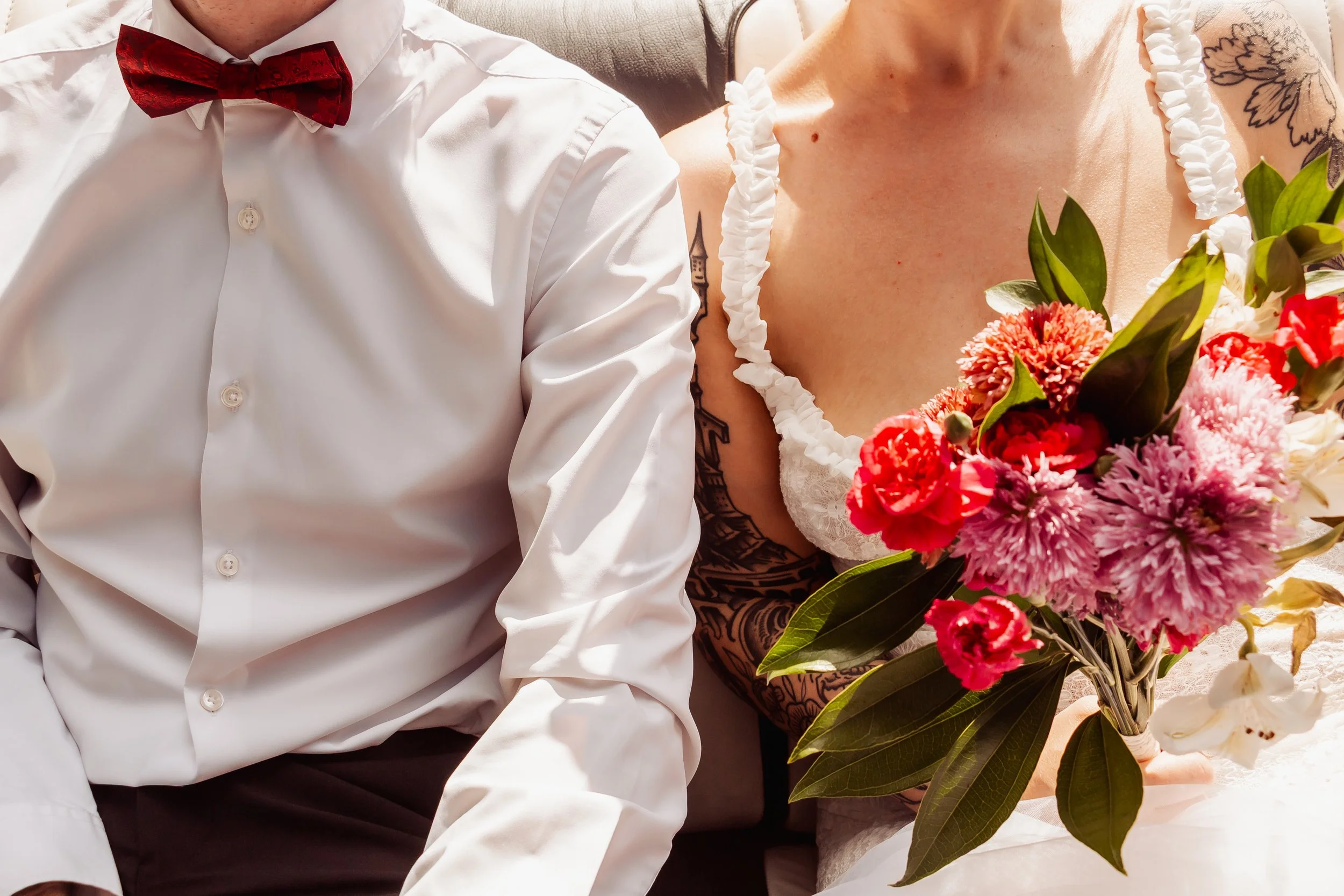 Close up of a married couple's outfits and florals at their Hollywood Cakewalk elopement.