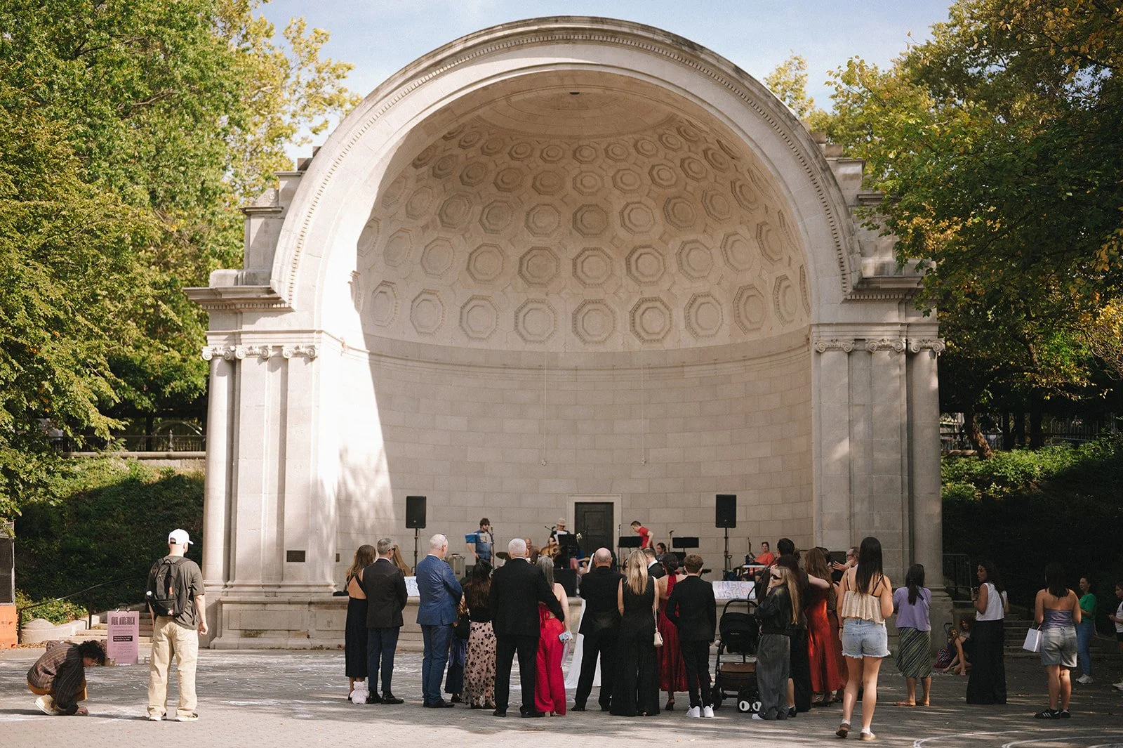 A micro wedding gathering at Naumburg Bandshell in Central Park, New York City.