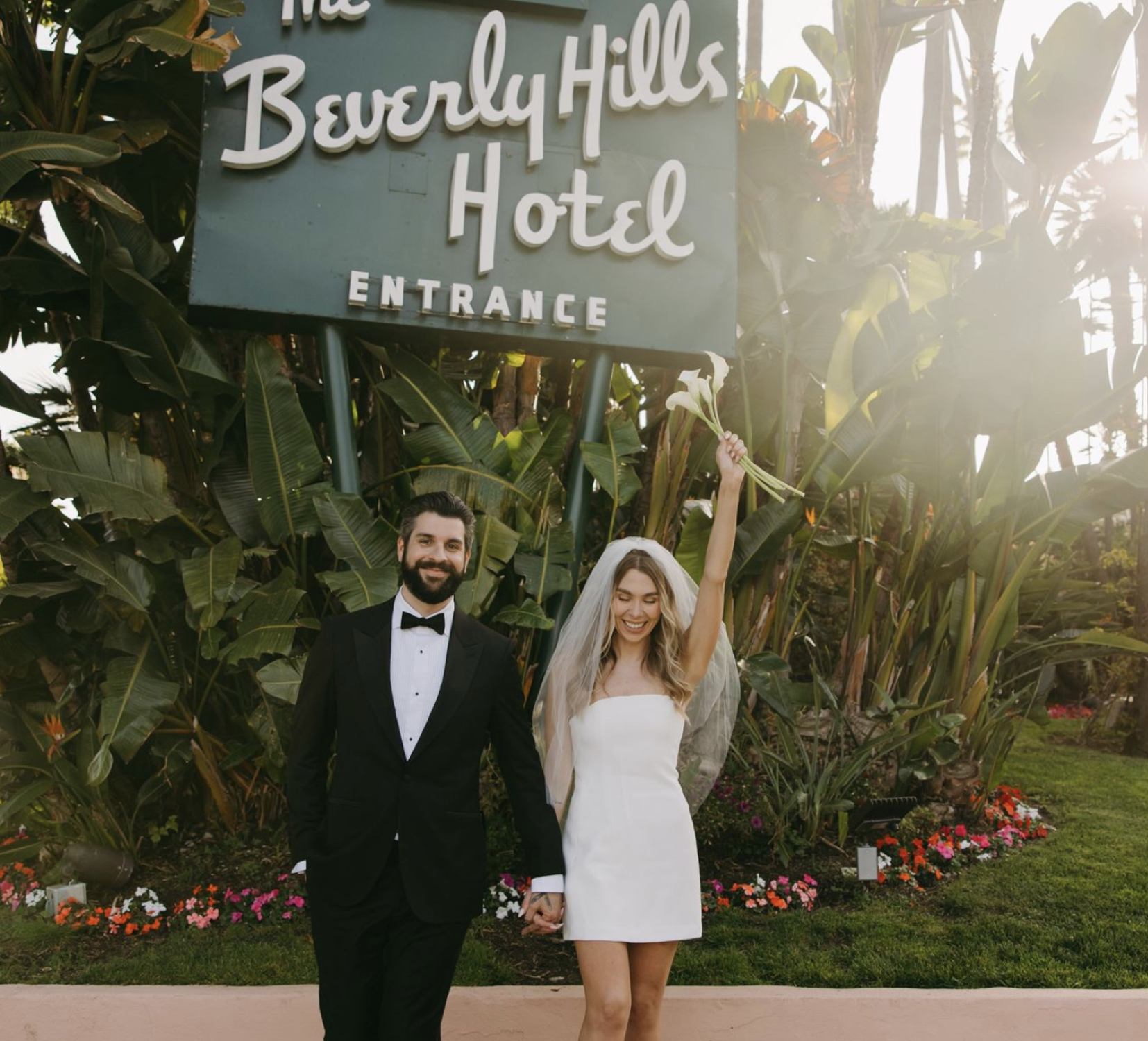Newlyweds at the Beverly Hills Hotel sign, a Los Angeles elopement