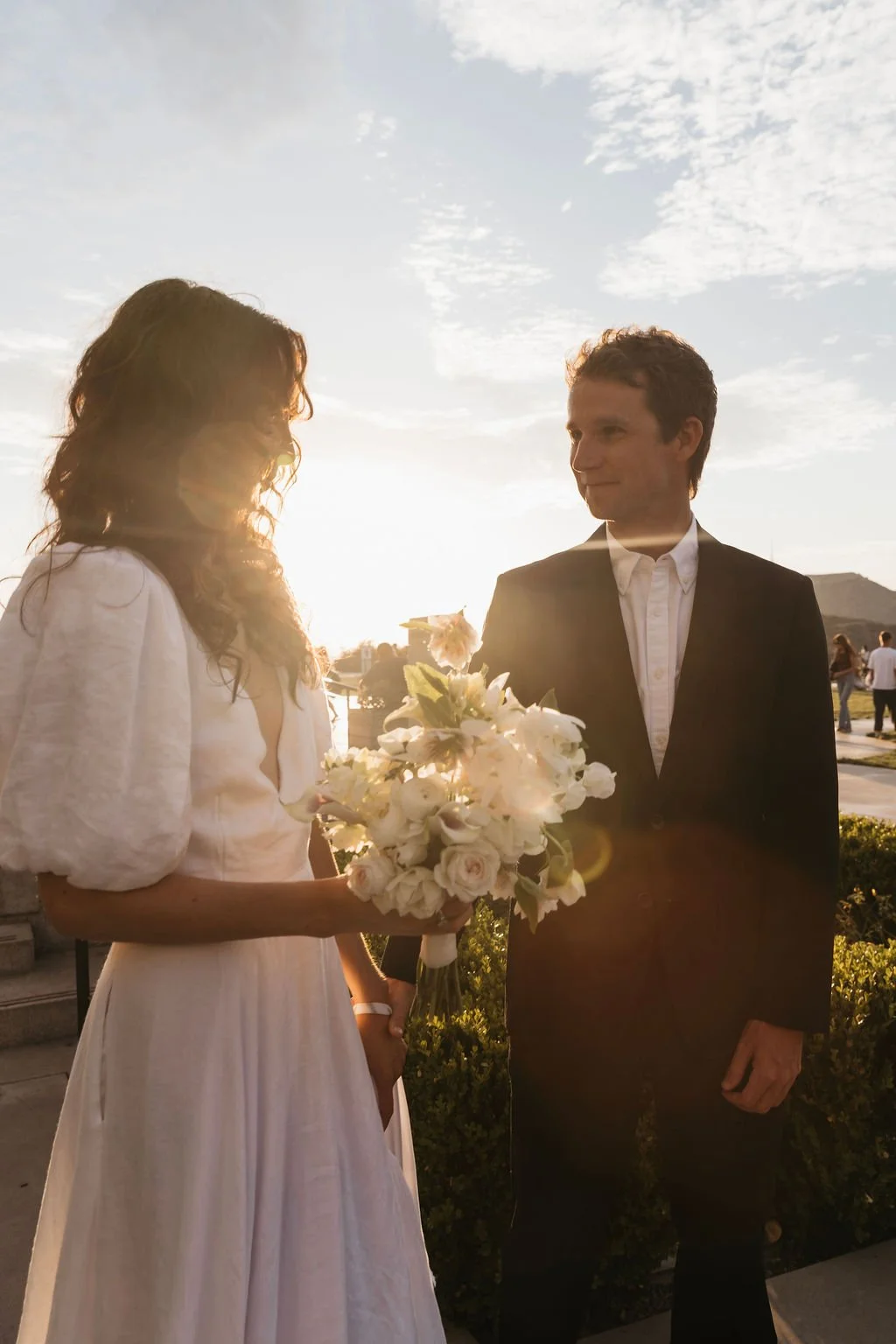 Couple dressed to get married at Griffith Park before sunset.
