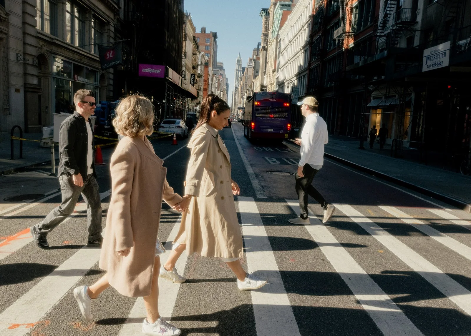 Lesbian brides crossing the street in Manhattan after their Cakewalk elopement.