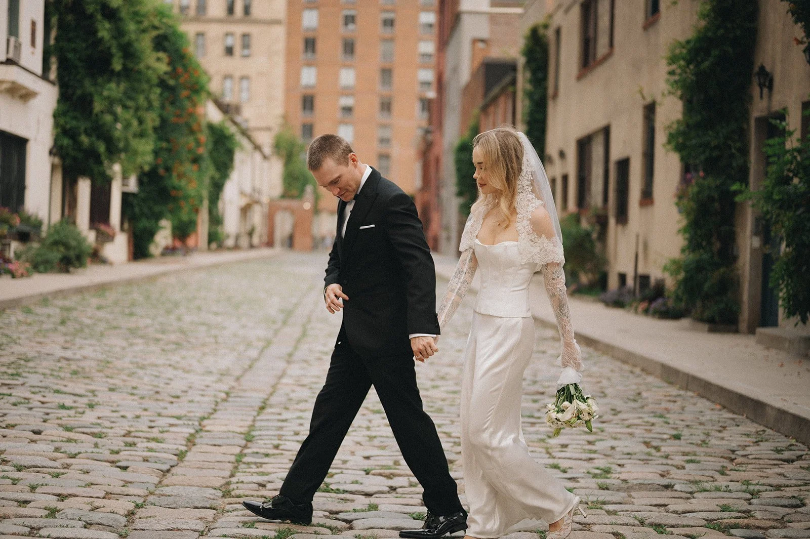 Couple walking through the West Village after their Cakewalk elopement.