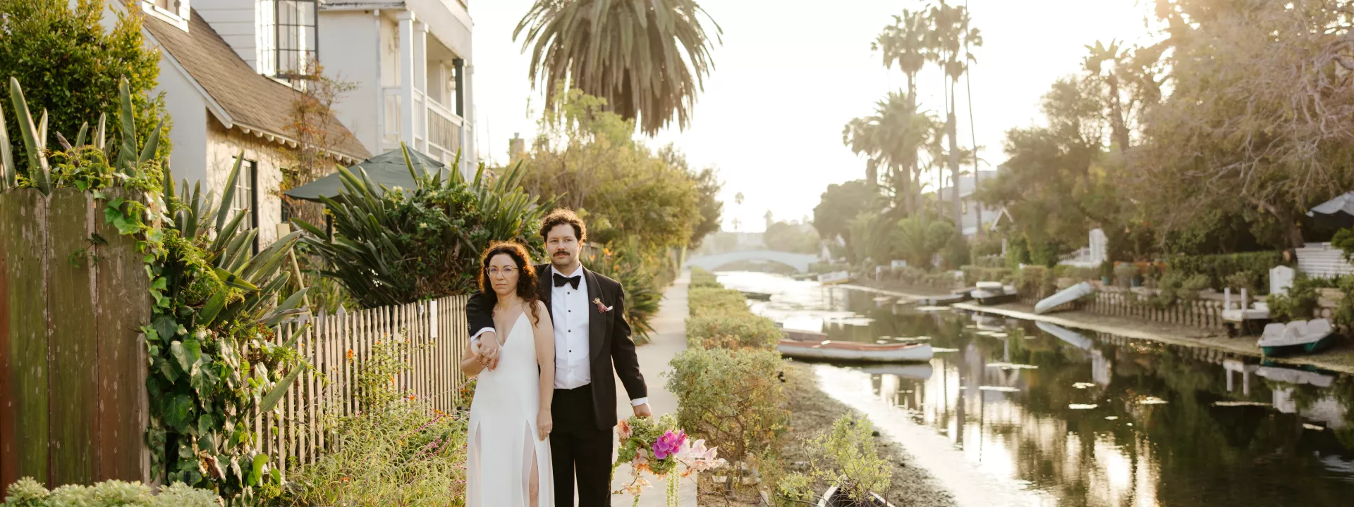 Couple walking a Los Angeles waterfront at sunset