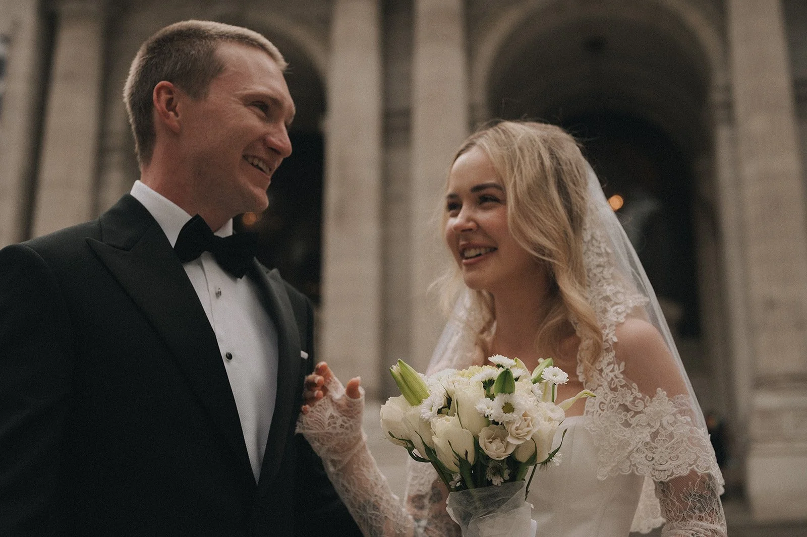 Close up of couple on the steps of New York Public Library after their Cakewalk elopement.