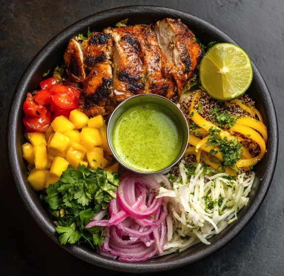 For Pros: Aji Verde Salad Bowl with Peruvian Chicken, Cilantro Mint Quinoa, Zucchini, Tomatoes, Shredded Raw Green Papaya, Shaved Cabbage, Cilantro, Mango, Pickled Onions, Lime, Green Aji Verde Sauce