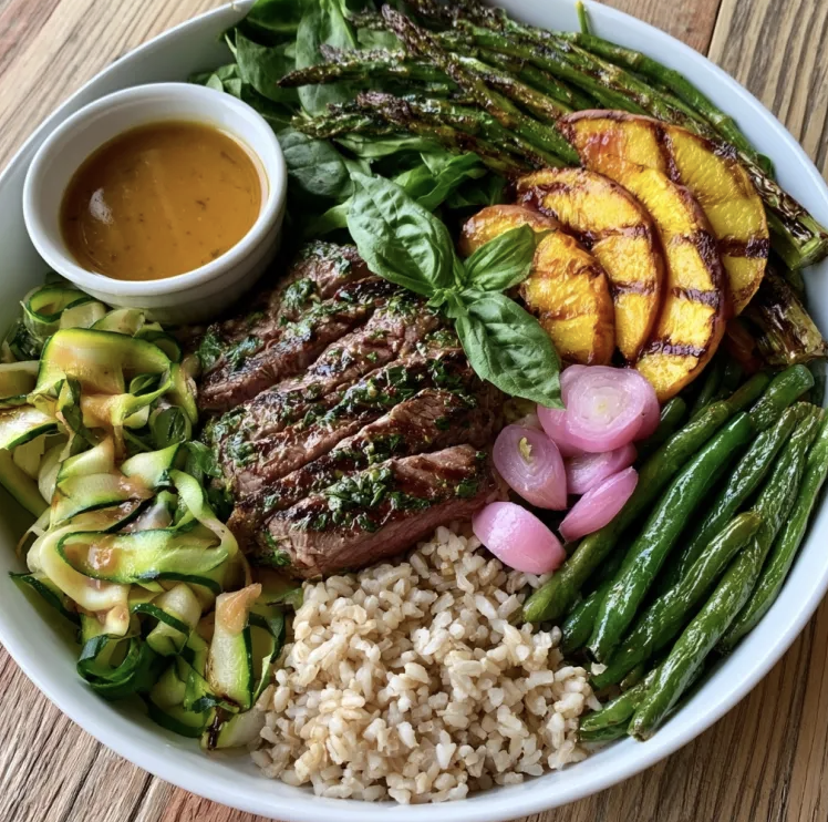 Peach Protein Bowl with Summer Herb Steak, Brown Rice, Green Beans, Zucchini Ribbons, Asparagus, Spinach, Roasted Peach, Basil, Pickled Shallots, Peach Balsamic Vinaigrette