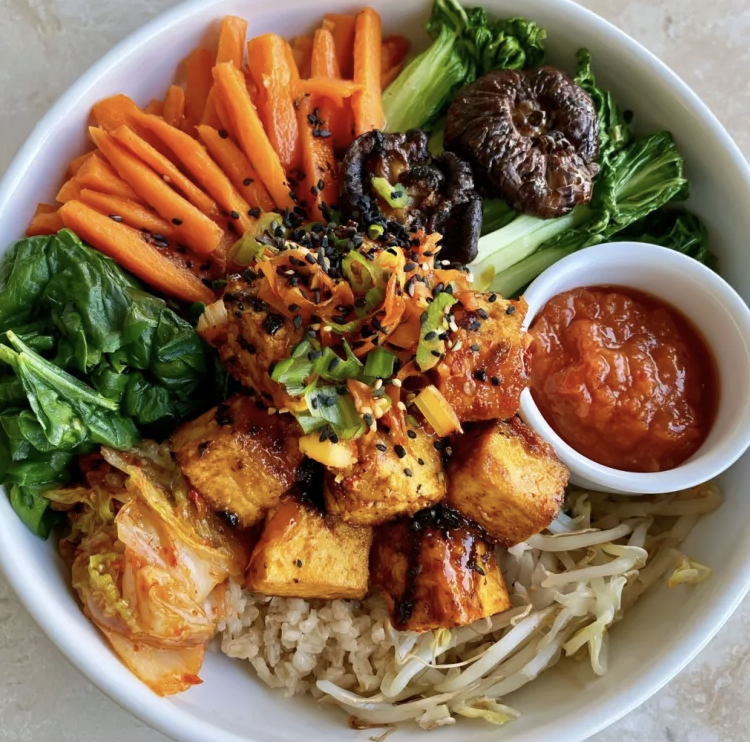 Probiotic Bibimbap Bowl with Kimchi Tofu, Brown Rice, Carrots, Bok Choy, Spinach, Shiitake Mushroom, Black Sesame Seeds, Kimchi, Bean Sprouts, Kimchi Sauce
