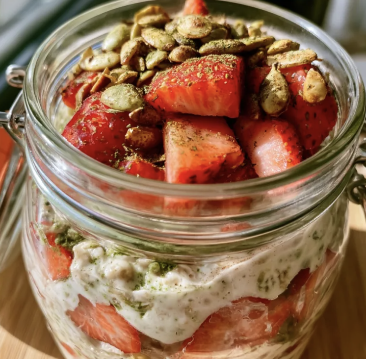 Strawberry Vanilla Matcha Overnight Oats with Cinnamon, Toasted Pumpkin Seeds, Matcha, and Strawberries