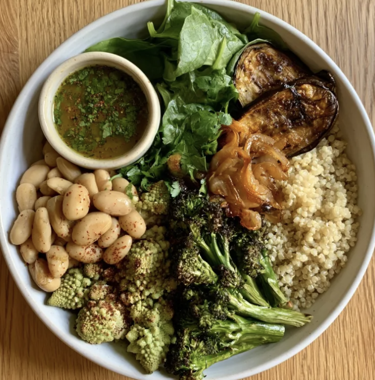 For Pros: Fiber Piccata Bowl with Braised White Beans & Romanesco Cauliflower, Lemon Quinoa, Caramelized Onions, Broccoli, Eggplant, Spinach, Parsley, Aleppo Pepper, Lemon Herb Vinaigrette