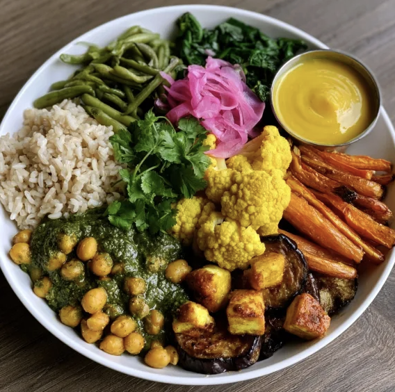 For Pros: Curry Fiber Bowl with Chana Saag, Brown Rice, Green Beans, Turmeric Cauliflower, Roasted Tamarind Carrots, Eggplant, Sautéed Paneer, Cilantro, Pickled Onion, Mango Chutney Sauce