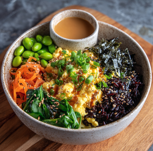 For Orca: Japanese Breakfast Bowl with Scrambled Eggs, Black Rice, Edamame, Pickled Daikon, Carrot, Spinach, Sesame Miso Dressing, Scallions, Nori, Sesame Seeds