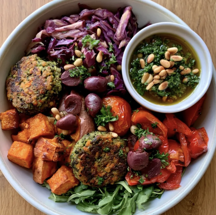 For Pros: Mediterranean Power Bowl with Broccoli-Lentil Patties, Roasted Sweet Potato, Red Cabbage, Tomato, Red Peppers, Arugula, Kalamata Olive, Toasted Pine Nuts, Parsley, Lemon-Oregano Vinaigrette