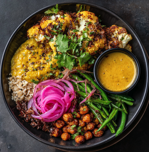 Anti-Inflammatory Bowl with Yellow Dal Tadka, Cumin Brown Rice, Cauliflower, Green Beans, Red Onion, Cilantro, Pickled Onion, Crispy Chickpeas, Spiced Mustard Cumin Drizzle