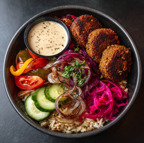 For Pros: Sumac Garden Bowl with Falafel, Brown Rice, Roasted Onion, Tomato, Cucumber, Roasted Red Pepper, Pickled Red Cabbage, Sumac, Tahini Sauce