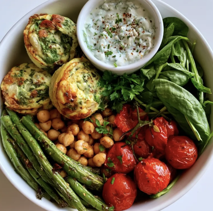 For Pros: Garden Vitality Bowl with Spinach Artichoke Egg Bake, Lemony Chickpeas, Roasted Tomatoes, Sautéed Green Beans, Spinach, Parsley, Herbed Feta Sauce