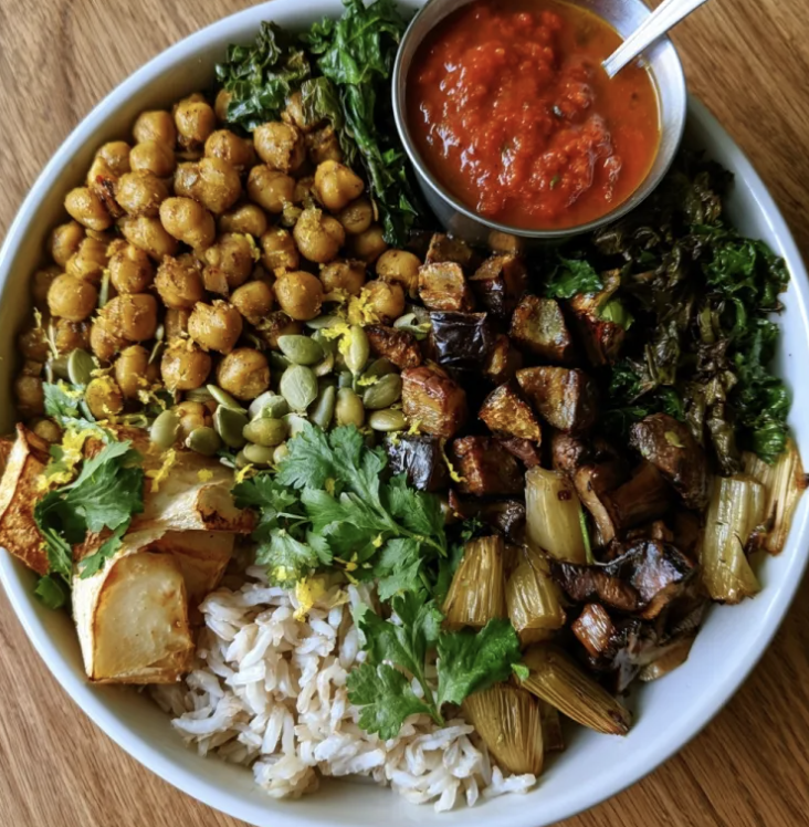 Golden Fiber Bowl with Chana Saag Chickpeas, Coconut Basmati Rice, Eggplant, Kale, Cumin Roasted Turnips, Mushrooms, Celery, Cilantro, Pepitas, Lemon Zest, Tomato Curry Sauce