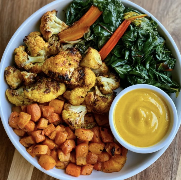 Square Fare Plate of Roasted Turmeric Cauliflower, Roasted Carrots, Sautéed Swiss Chard, Tajine Sauce