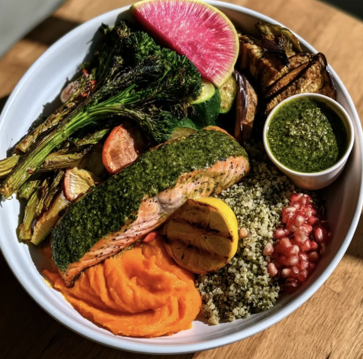 Chlorophyll Omega Bowl with Kale Pesto Salmon, Lemon Quinoa, Broccolini, Zucchini, Carrot Purée, Eggplant, Hemp Seeds, Watermelon Radish, Kale Pesto