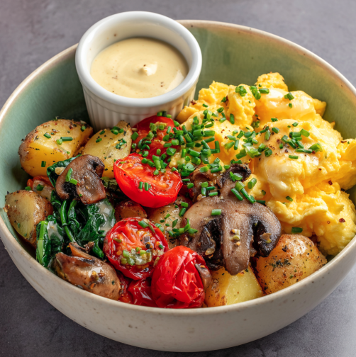 For Pros: Sunrise Breakfast Bowl with Scrambled Eggs, Herbed Breakfast Potatoes, Spinach, Broccolini, Mushrooms, Roasted Cherry Tomatoes, Chives, Dijon-Yogurt Sauce