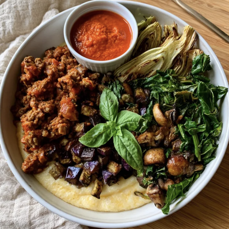 Rustic Tuscan Bowl with Italian Fennel Ground Pork Ragù, Creamy Polenta, Eggplant, Mushrooms, Kale, Fennel, Basil, Tomato & Roasted Red Pepper Sauce