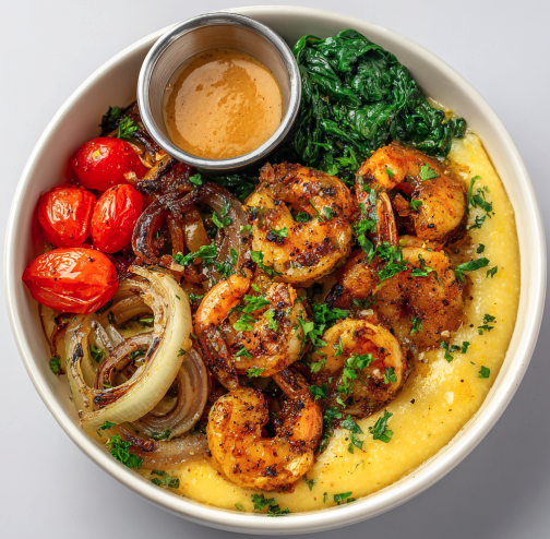 For Pros: Cajun Recovery Bowl with Cajun-Garlic Shrimp, Creamy Polenta, Parsnip, Spinach, Roasted Onion, Cherry Tomatoes, Sautéed Garlic, Parsley and a Cajun Sauce