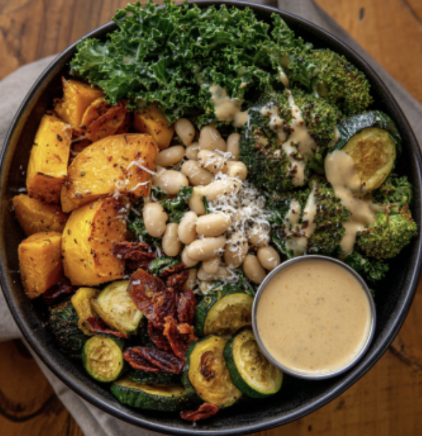 For Pros: Tuscan Nourish Bowl with Creamy Tuscan White Beans, Roasted Butternut Squash, Broccoli, Roasted Zucchini, Kale, Basil, Parmesan, Sundried Tomato, Marry Me Sauce