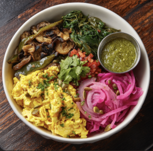 For Pros: Sunrise Bowl with Breakfast Tacos Scrambled Eggs, Roasted Poblanos, Steamed Spinach, Mushrooms, Shredded Red Cabbage, Cilantro, Pickled Red Onions, Pepitas, Salsa Verde